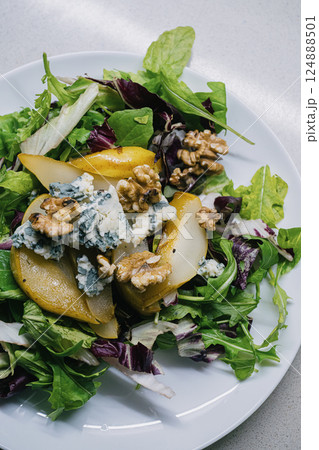 A delightful Fresh Salad beautifully featuring Pears, Blue Cheese, and crunchy Walnuts 124888501