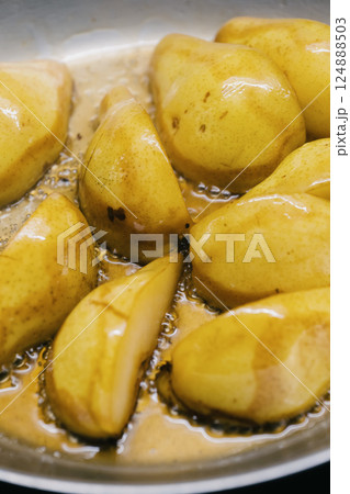 Deliciously Caramelized Pears Cooked with Care in a Pan Perfect for Any Meal or Dessert 124888503