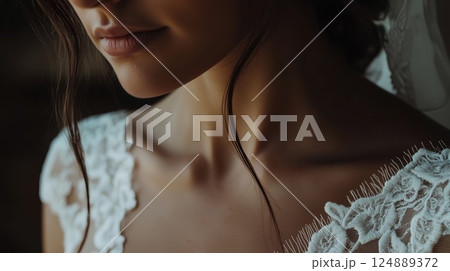 Woman with a white dress and a lace collar. She has a white lace collar on her dress 124889372