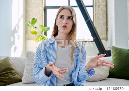 Web camera view of teenage girl talking looking in camera, online meeting, video call Web camera view of teenage girl talking looking in camera, online meeting, video call 124889704