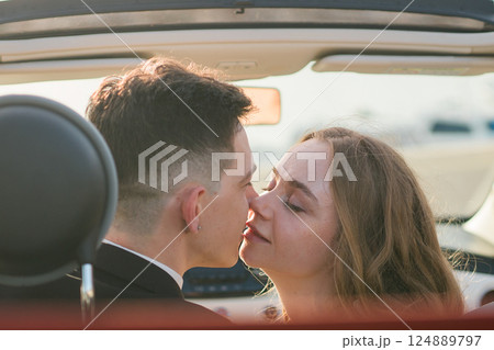 beautiful wedding couple in park. kiss and hug each other. 124889797