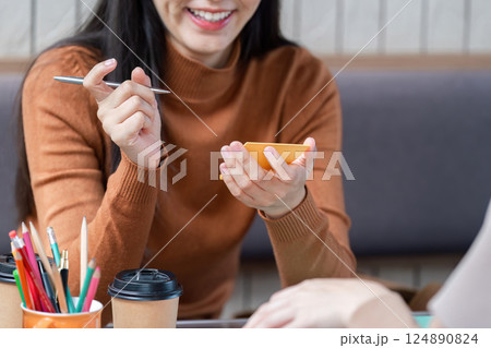 Peer Engagement and Exchange. A vibrant discussion between two students over study materials. 124890824