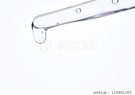 Pipette with delicate blue serum close-up. Pipette with delicate blue serum close-up. 124891263