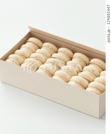 Box of white macarons arranged neatly in elegant packaging, suitable for background 124891447