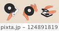 Hands holding a vinyl record. Portable turntable with vinyl playing. Old gramophone with analog grooved LP disc. 124891819