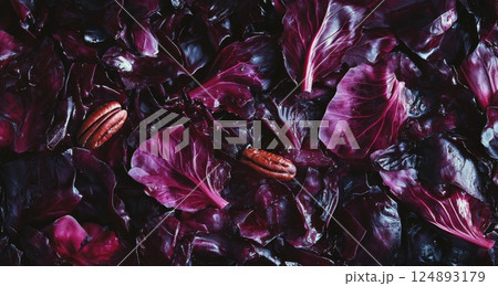 Vibrant red cabbage leaves and pecans create a colorful base for dishes Vibrant red cabbage leaves and pecans create a colorful base for dishes 124893179