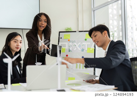 Collaborative ESG Discussion in a Corporate Environment. A team engages in brainstorming innovative solutions for sustainable practices. Collaborative ESG Discussion in a Corporate Environment. A team engages in brainstorming innovative solutions for sustainable practices. 124894193