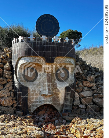 Ancient mask sculpture at Teatro Andromeda in Sicily Ancient mask sculpture at Teatro Andromeda in Sicily 124895398