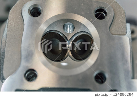 gasoline combustion chamber on a motorcycle. valve cover on a scooter 124896294