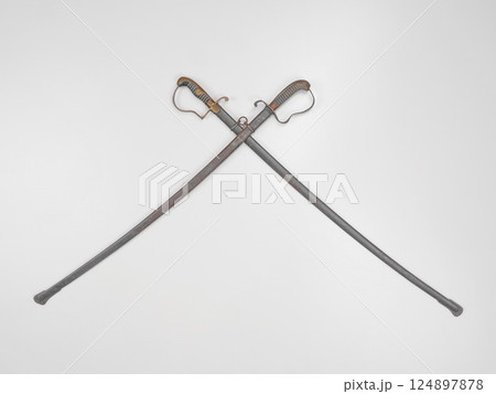 Two swords are displayed in a white background 124897878
