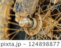 dirty off-road enduro motorcycle wheel. dirt motorcycle tire from off-road racing 124898877