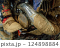 dirty muffler on a mountain bike. scooter exhaust system after mud racing 124898884