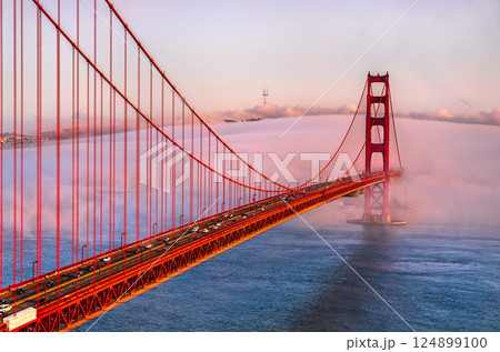 Golden Gate Bridge Shrouded in Mystical Fog Overlooking the Bay in San Francisco - California, United States Golden Gate Bridge Shrouded in Mystical Fog Overlooking the Bay in San Francisco - California, United States 124899100