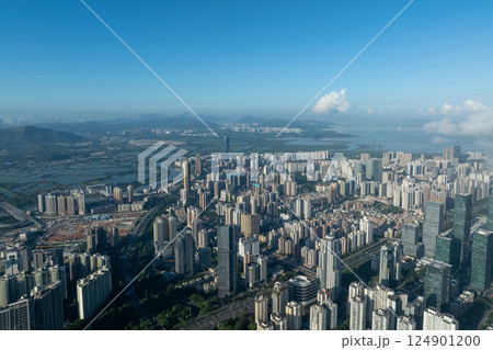 Aerial view of high voltage electric tower in city 124901200