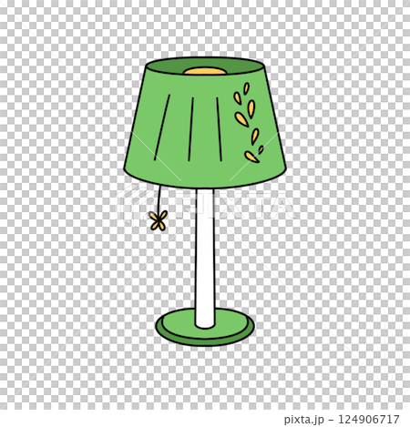 A green lamp with a yellow shade and a leaf design 124906717