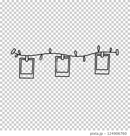 A string of lights with three picture frames hanging from it 124906760