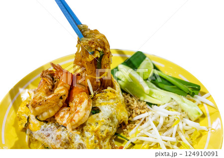 Top view of Prawn Pad Thai in yellow dish, focus selective Top view of Prawn Pad Thai in yellow dish, focus selective 124910091