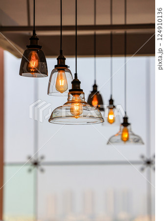Decorated hanging lamps and light bulbs decorated in a living zone. Decorated hanging lamps and light bulbs decorated in a living zone. 124910136
