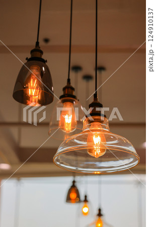 Decorated hanging lamps and light bulbs decorated in a living zone. Decorated hanging lamps and light bulbs decorated in a living zone. 124910137