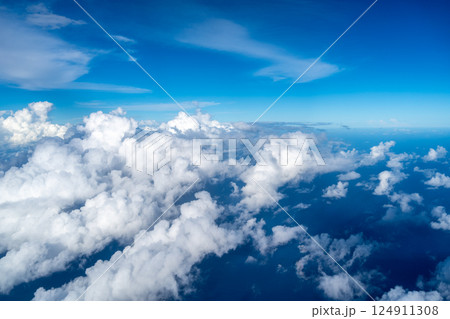 Aerial view of fluffy clouds over the Pacific Ocean in Polynesia Aerial view of fluffy clouds over the Pacific Ocean in Polynesia 124911308
