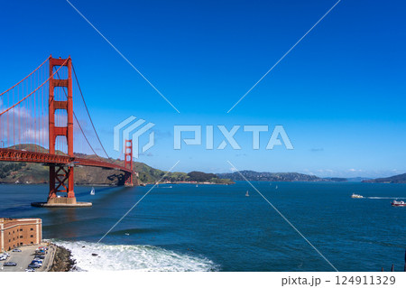 Golden Gate Bridge over blue waters with scenic hills in San Francisco 124911329