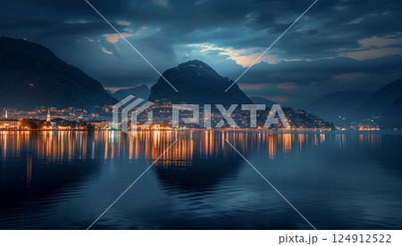 A reflection of lights and mountains in a lake A reflection of lights and mountains in a lake 124912522