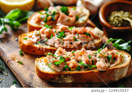 Three sandwiches with meat and herbs on top of them 124915037