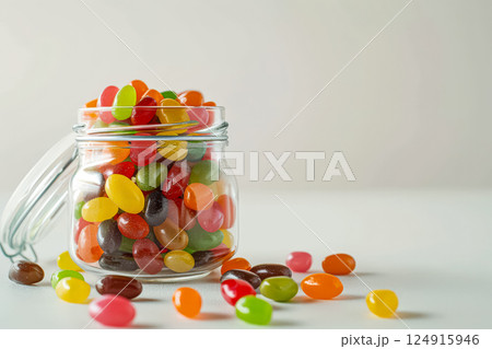 Jar full of colorful jelly beans. 124915946
