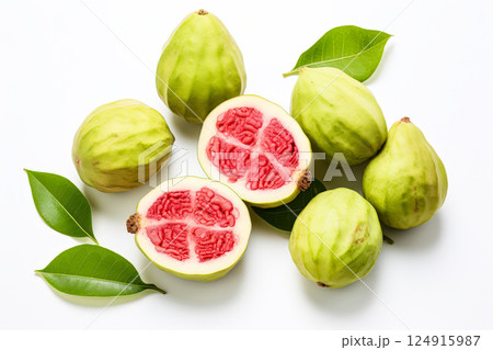 Pile of green guavas with one of them cut open. Pile of green guavas with one of them cut open. 124915987