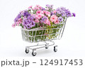 Shopping cart with summer pink flowers on white background, an empty space for text. Festive banner, template for advertisements of online shopping, flower delivery, weddings, floral gifts 124917453
