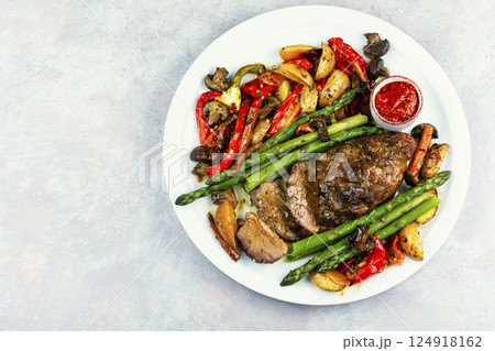 Roasted duck breast with vegetables. 124918162