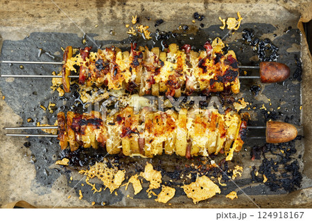 Delicious kebab of bacon and potatoes. Delicious kebab of bacon and potatoes. 124918167