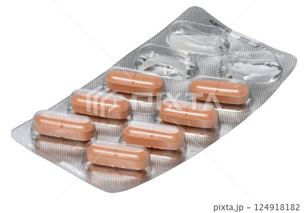 Silver blister pack containing orange oblong pills. Two compartments in the upper right corner of the pack are empty 124918182