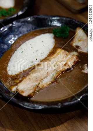 Delicious Japanese style curry rice topped with pork belly on plate. Selective focus. 124918905