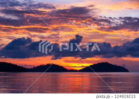 Colorful sky in the morning at Saphanhin public beach, Phuket, Thailand. 124919213