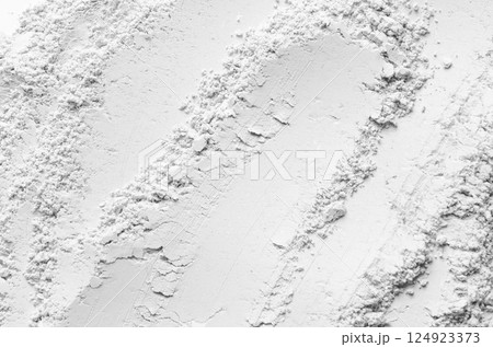 The texture of dry cosmetic clay for a skin mask. The texture of dry cosmetic clay for a skin mask. 124923373