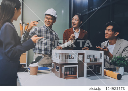 Construction, planning and architects meeting about design of building, strategy and working in industrial collaboration. Architecture workers talking about maintenance project with paper and a model 124923578