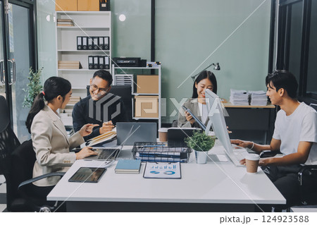 Cheerful meeting room, businesspeople celebrate with handshaking. Successful project was completed before the deadline. Business partnership and collaboration in project management. Habiliment Cheerful meeting room, businesspeople celebrate with handshaking. Successful project was completed before the deadline. Business partnership and collaboration in project management. Habiliment 124923588