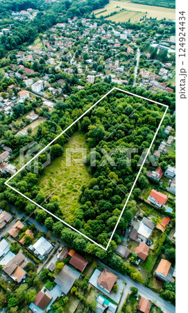 Lush Green Land Surrounded by Homes 124924434
