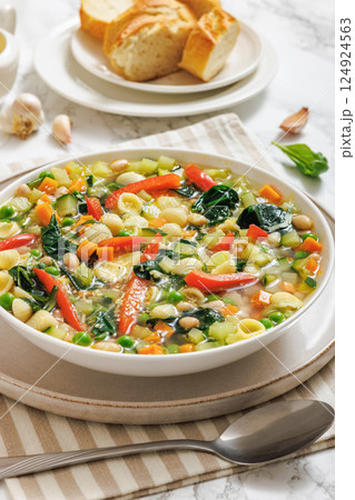 Vegetarian Minestrone with in white bowl, top view Vegetarian Minestrone with in white bowl, top view 124924563