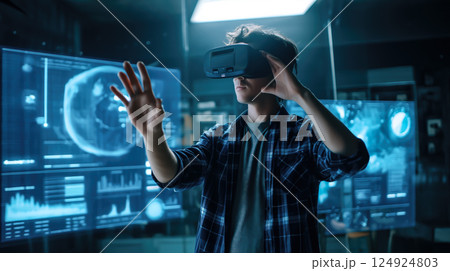 A student man learns online with futuristic technology. The concept of education, innovation, and digital learning. Generative AI. A student man learns online with futuristic technology. The concept of education, innovation, and digital learning. Generative AI. 124924803