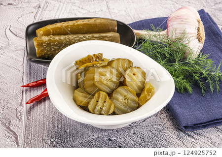 Sliced marinated cucumbers in the bowl Sliced marinated cucumbers in the bowl 124925752