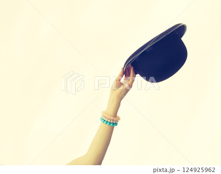Somebody holding retro hat 124925962