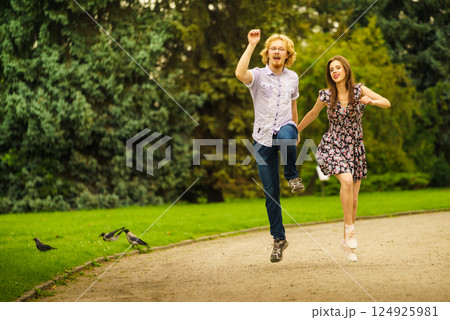 Happy couple playing in park 124925981