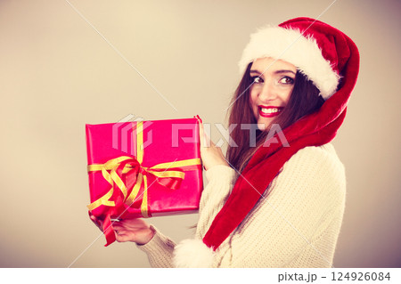 Woman holding gift box. Christmas time Woman holding gift box. Christmas time 124926084