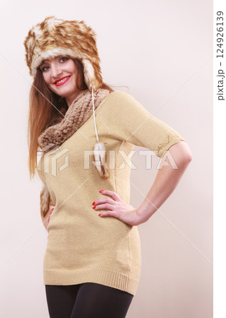 Winter woman in warm clothing fur cap Winter woman in warm clothing fur cap 124926139
