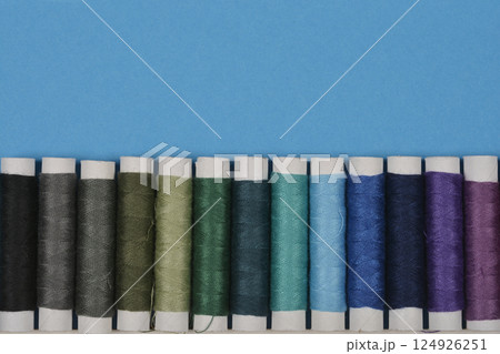 Colorful spools of thread 124926251