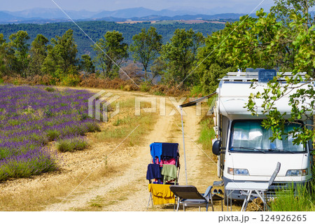 Clothes hanging to dry outdoors by camping car. Caravan vacation in France Clothes hanging to dry outdoors by camping car. Caravan vacation in France 124926265