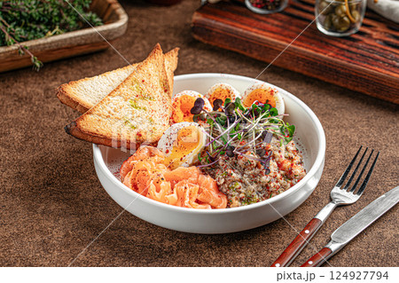 Portion o breakfast with salmon and eggs Portion o breakfast with salmon and eggs 124927794