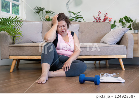 Struggling with weight management overweight individual fitness journey at home emotional wellness indoor self reflection Struggling with weight management overweight individual fitness journey at home emotional wellness indoor self reflection 124928387